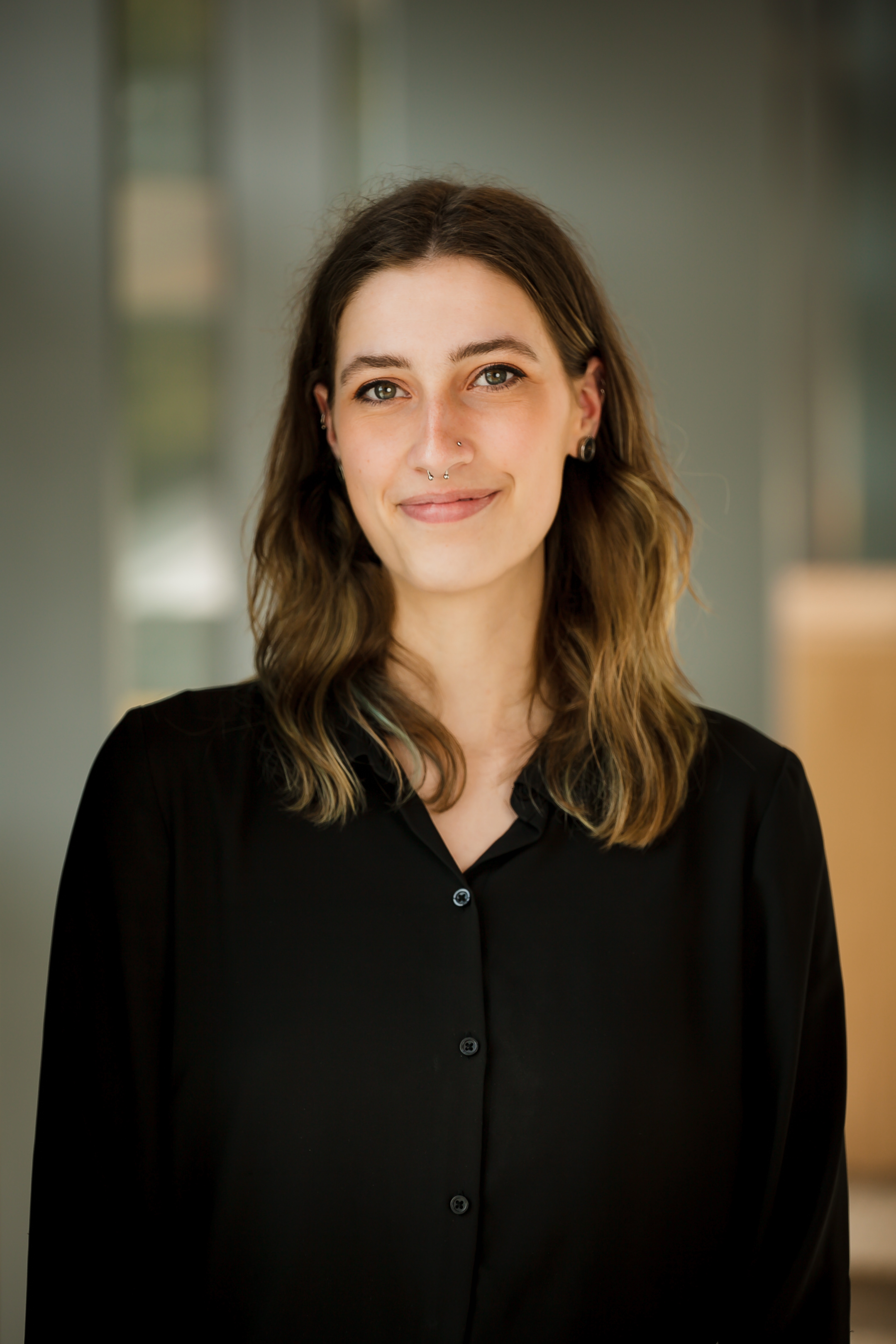 Professional headshot of Sidra.